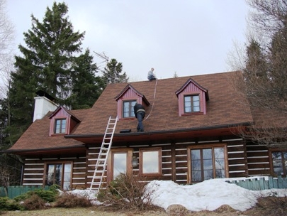 Roof repairers in action